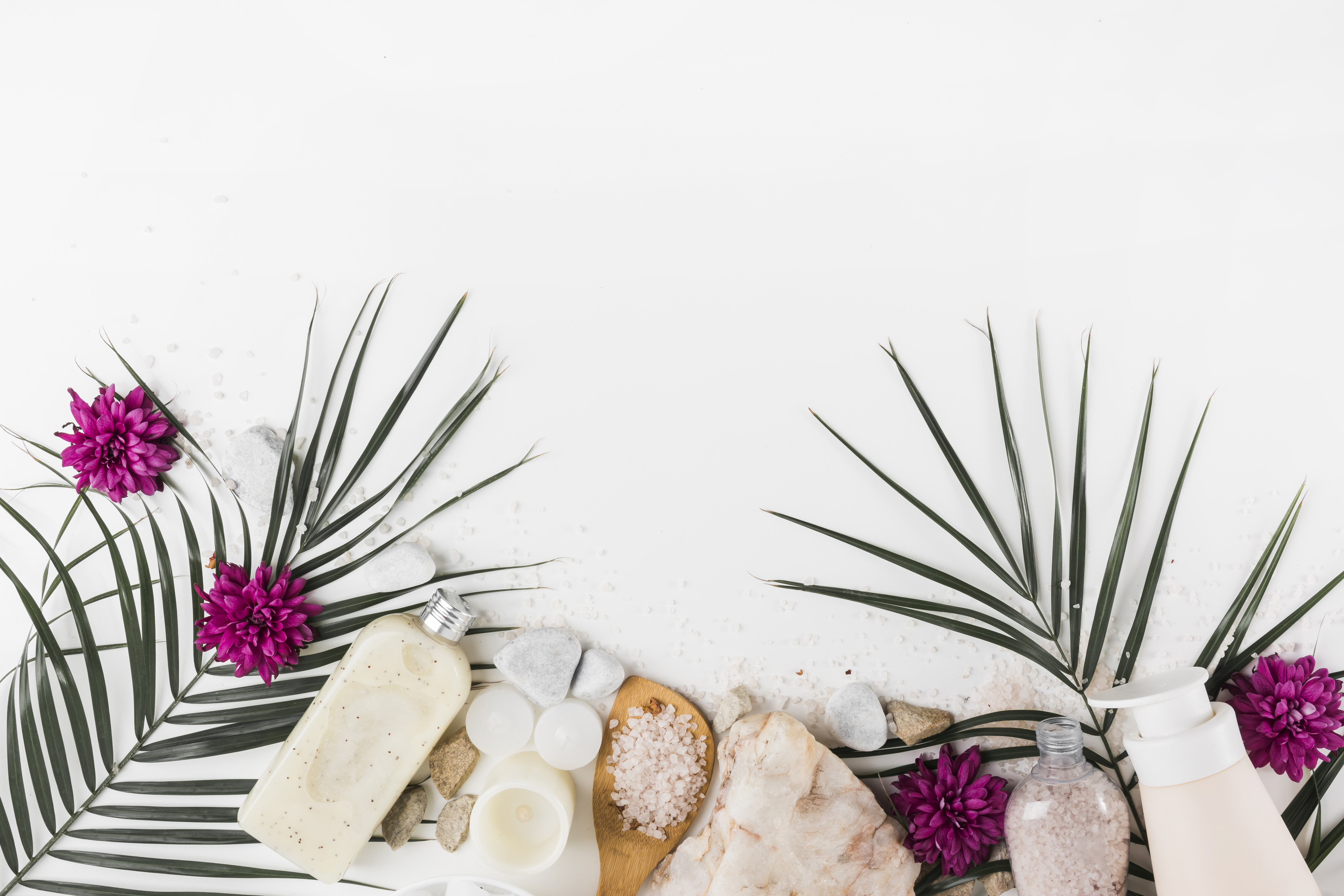 palm-leaves-flower-body-scrub-salt-spa-stones-white-background